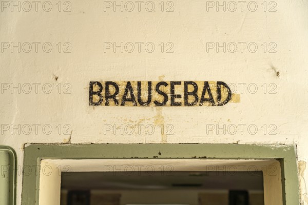 Shower bath inscription on a gas chamber, Dachau Concentration Camp Memorial, Bavaria, Germany