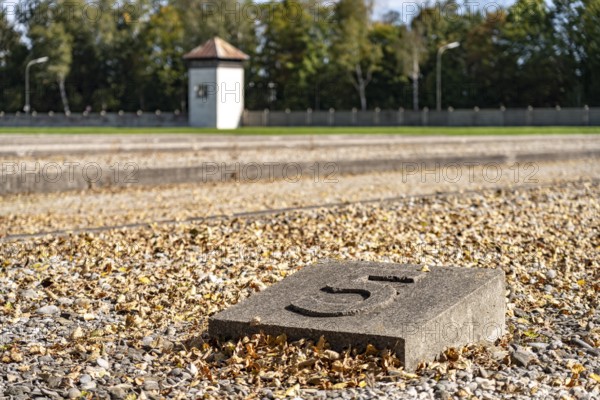 Foundations of the prisoners' barracks and watchtower, Dachau Concentration Camp Memorial, Bavaria, Germany