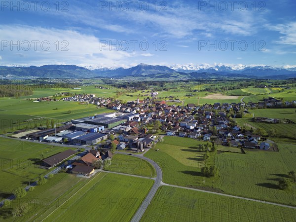 View of the village, in the foreground the industrial area, in the background the Rigi and the snow-covered Alps, Auw, Freiamt, Canton, Aargau, Switzerland