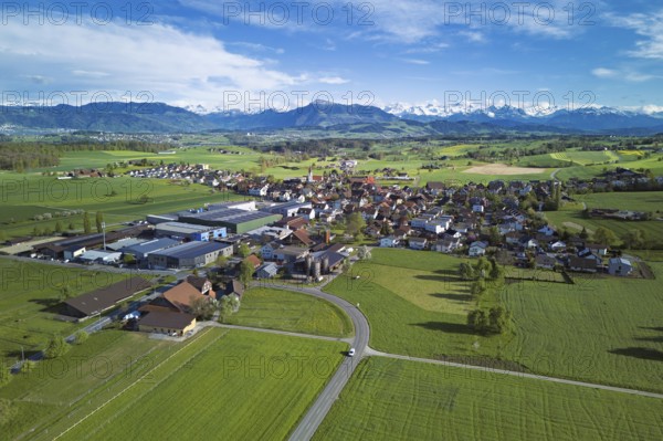 View of the village, in the foreground the industrial area, in the background the Rigi and the snow-covered Alps, Auw, Freiamt, Canton, Aargau, Switzerland