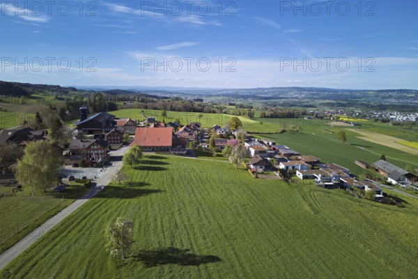 View of the village, in the background the industrial area of Muri, Geltwil, Freiamt, Canton, Aargau, Switzerland