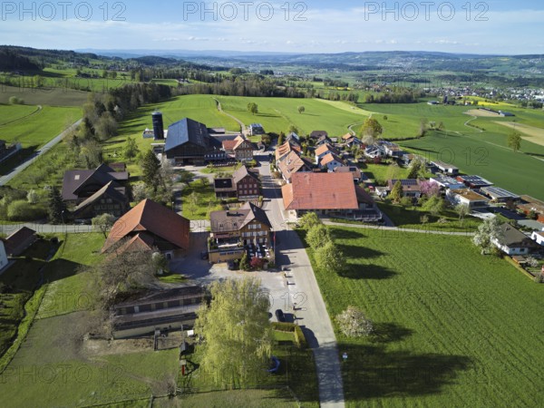 View of the village, in the background the industrial area of Muri, Geltwil, Freiamt, Canton, Aargau, Switzerland