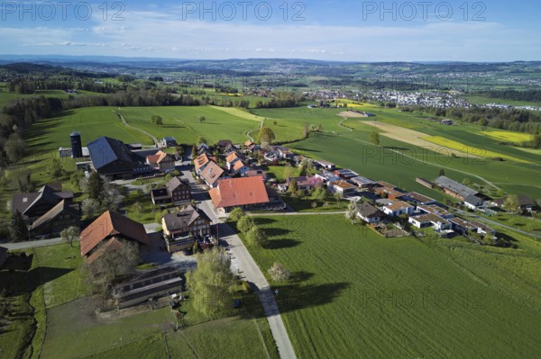 View of the village, in the background the industrial area of Muri, Geltwil, Freiamt, Canton, Aargau, Switzerland