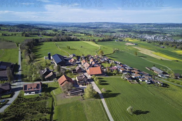 View of the village, in the background the industrial area of Muri, Geltwil, Freiamt, Canton, Aargau, Switzerland