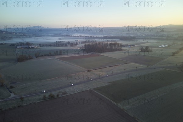 Agricultural fields and meadows in the early morning fog, Reuss Valley, Merenschwand, Freiamt, Canton, Aargau, Switzerland