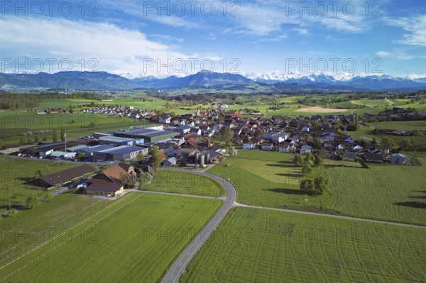 View of the village, in the foreground the industrial area, in the background the Rigi and the snow-covered Alps, Auw, Freiamt, Canton, Aargau, Switzerland