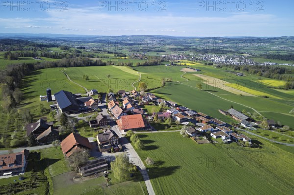 View of the village, in the background the industrial area of Muri, Geltwil, Freiamt, Canton, Aargau, Switzerland