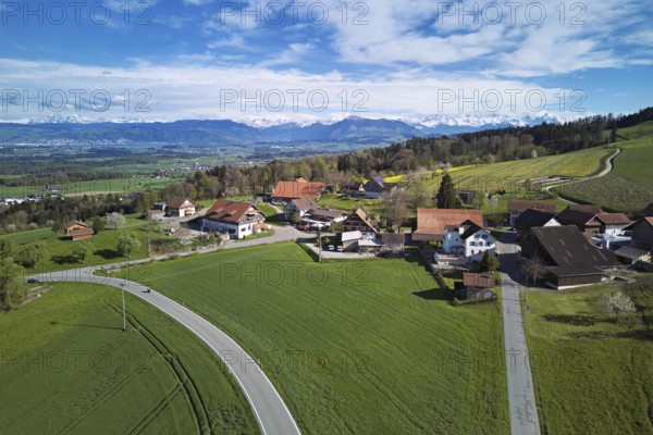 View of the hamlet of Brunnwil, behind the Rigi and the snow-covered Alps, Beinwil, Freiamt, Canton, Aargau, Switzerland