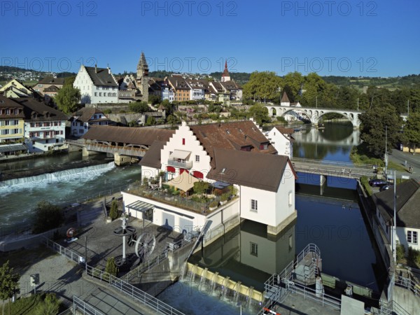 Old town with the tower of the Muri- Amthof, in the foreground the weir and the museum Reusskraftwerk Bruggmühle on the river Reuss, Bremgarten, Freiamt, Canton, Aargau, Switzerland
