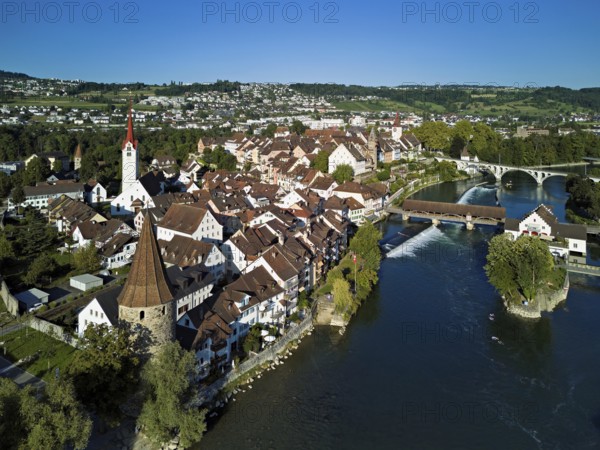 Old town with the Catholic Church of St. Nicholas, the tower of the Muri- Amthof and the witches' tower, on the right the museum Reusskraftwerk Bruggmühle and the old wooden bridge over the river Reuss, Bremgarten, Freiamt, Canton, Aargau, Switzerland