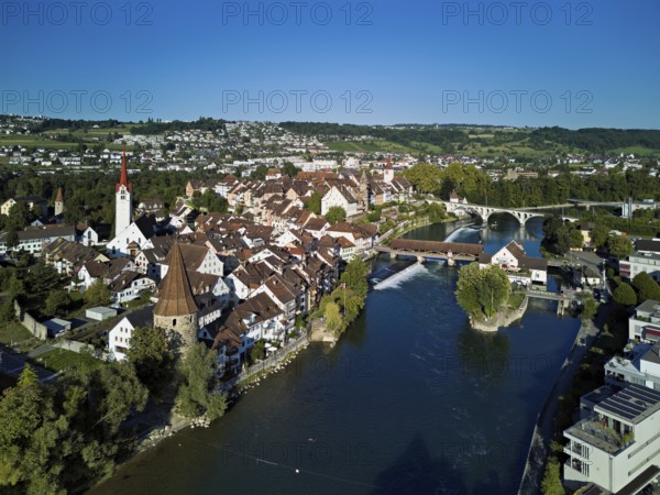 Old town with the Catholic Church of St. Nicholas, the tower of the Muri- Amthof and the witches' tower, on the right the museum Reusskraftwerk Bruggmühle and the old wooden bridge over the river Reuss, Bremgarten, Freiamt, Canton, Aargau, Switzerland