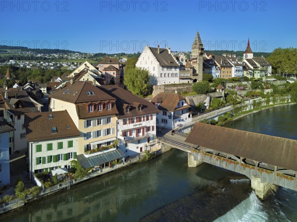 Old town with the tower of the Muri- Amthof, in the foreground the weir and the old wooden bridge over the river Reuss, Bremgarten, Freiamt, Canton, Aargau, Switzerland