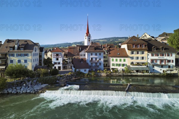 Old town with the Catholic Church of St Nicholas, in the foreground the weir on the river Reuss, Bremgarten, Freiamt, Canton, Aargau, Switzerland