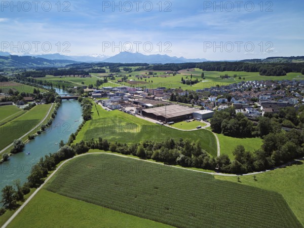 View of the village, industrial area on the right, Pilatus in the background, Sins, Freiamt, Canton Aargau, Switzerland