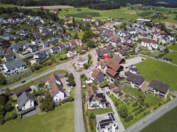 View of the village with the Roman Catholic parish church of St Anna, behind the Lindenberg, Mühlau, Freiamt, Canton, Aargau, Switzerland