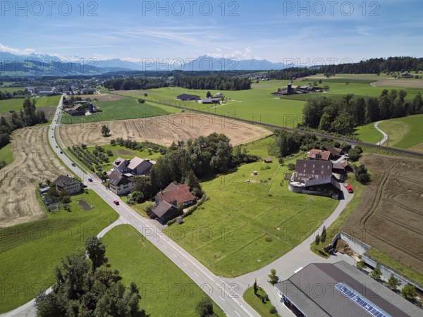 Main road leads through the hamlet of Reussegg, behind the Pilatus Sins, Freiamt, Canton, Aargau, Switzerland