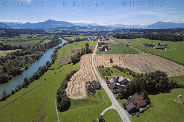 Main road leads through the hamlet of Reussegg, on the left the river Reuss, behind the Pilatus and the Rigi, Sins, Freiamt, Canton, Aargau, Switzerland