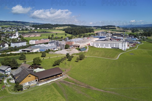 Industrial area and the village with the catholic parish church Mariä Geburt, Sins, Freiamt, Canton, Aargau, Switzerland