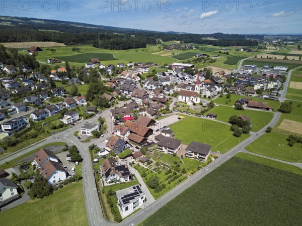 View of the village with the Roman Catholic parish church of St Anna, behind the Lindenberg, Mühlau, Freiamt, Canton, Aargau, Switzerland