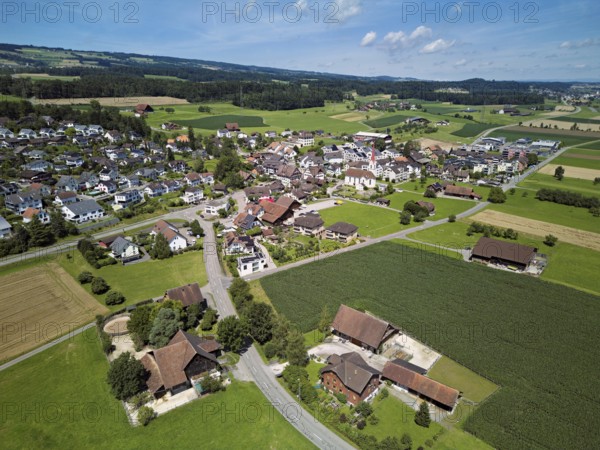 View of the village with the Roman Catholic parish church of St Anna, behind the Lindenberg, Mühlau, Freiamt, Canton, Aargau, Switzerland