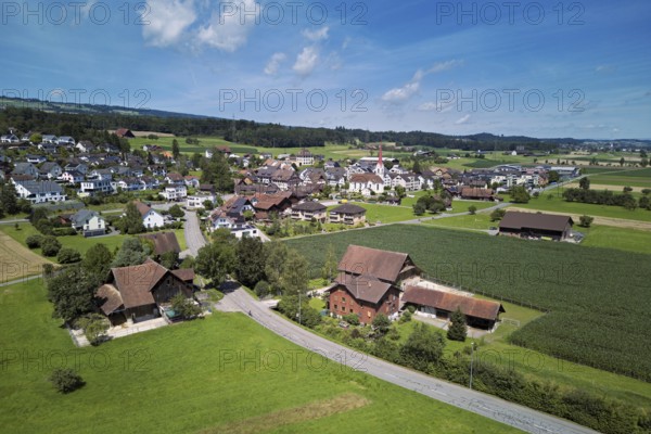 View of the village with the Roman Catholic parish church of St Anna, behind the Lindenberg, Mühlau, Freiamt, Canton, Aargau, Switzerland