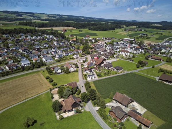 View of the village with the Roman Catholic parish church of St Anna, behind the Lindenberg, Mühlau, Freiamt, Canton, Aargau, Switzerland