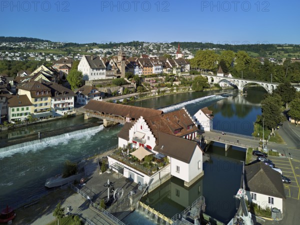 Old town with the tower of the Muri- Amthof, in the foreground the weir and the museum Reusskraftwerk Bruggmühle on the river Reuss, Bremgarten, Freiamt, Canton, Aargau, Switzerland