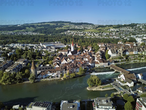 Old town with the Catholic Church of St Nicholas and the Witches' Tower, in the foreground the Museum Reusskraftwerk Bruggmühle and the old wooden bridge over the river Reuss, Bremgarten, Freiamt, Canton, Aargau, Switzerland