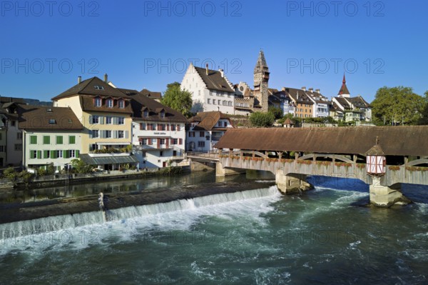 Old town with the tower of the Muri- Amthof, in the foreground the weir and the old wooden bridge over the river Reuss, Bremgarten, Freiamt, Canton, Aargau, Switzerland