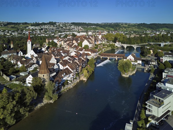 Old town with the Catholic Church of St. Nicholas, the tower of the Muri- Amthof and the witches' tower, on the right the Museum Reusskraftwerk Bruggmühle and the old wooden bridge over the river Reuss, Bremgarten, Freiamt, Canton, Aargau, Switzerland