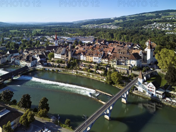 Old town with the Catholic Church of St. Nicholas and the tower of the Muri- Amthof, in the foreground the upper weir and the railway bridge over the river Reuss, Bremgarten, Freiamt, Canton, Aargau, Switzerland
