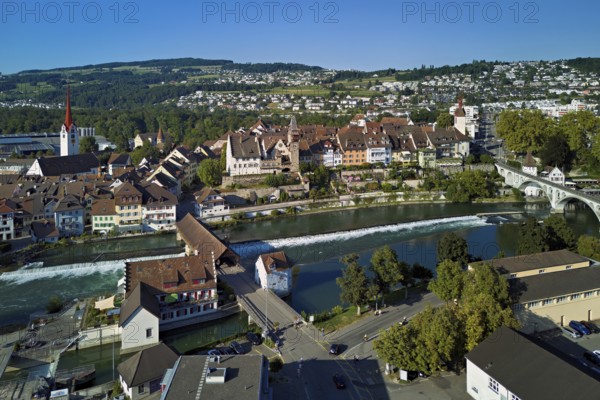 Old town with the Catholic Church of St Nicholas and the tower of the Muri- Amthof, in the foreground the weir and the old wooden bridge over the river Reuss, Bremgarten, Freiamt, Canton, Aargau, Switzerland