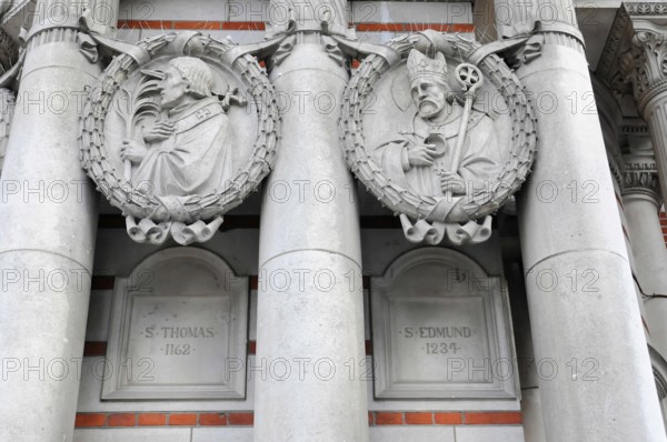 London, England, Great Britain, Europe, Two stone reliefs of historical figures on a Gothic architecture with rich decoration