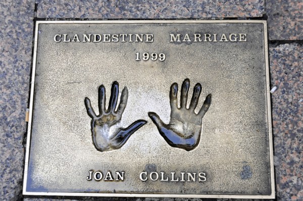 Metal plate with handprints and the inscription of Joan Collins, Clandestine Marriage 1999, London, England, Great Britain