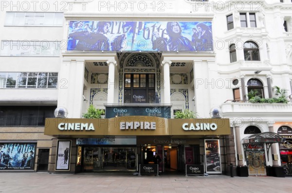 London, England, Great Britain, Europe, Exterior view of a cinema with casino in London, decorative facade with film posters