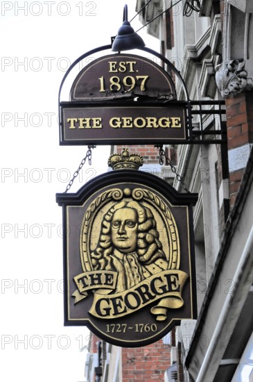 London, England, Great Britain, Europe, Traditional pub sign with decorations and historical depiction in dark wood look