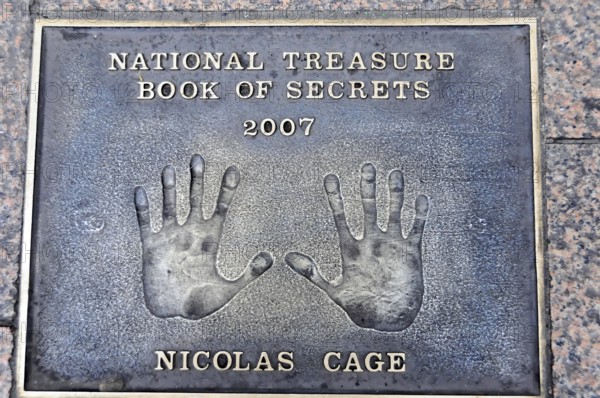 Nicolas Cage's handprints for National Treasure on a metal plate on the pavement, London, England, Great Britain