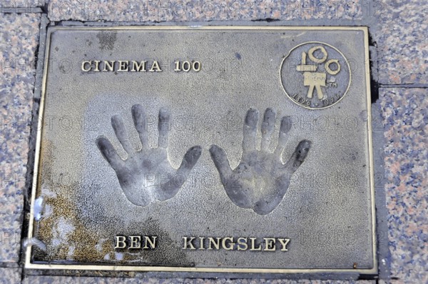 Ben Kingsley's handprints for Cinema 100 on a metal plate in the pavement, London, England, Great Britain