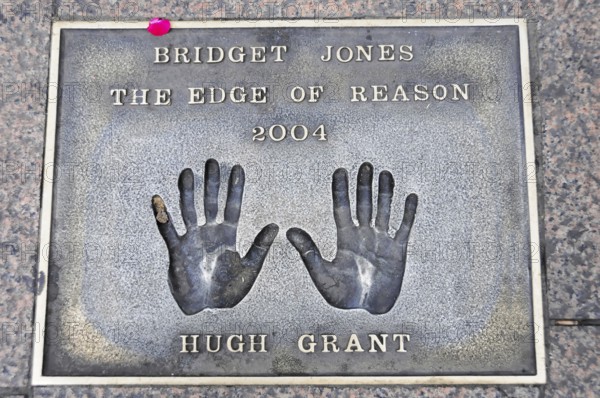Handprints of Hugh Grant for the film Bridget Jones on a metal plate on the pavement, London, England, Great Britain