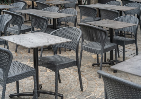 Outdoor scenery with tables and chairs seen in Normandy, France