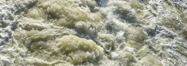 Full frame high angle shot of wild water in sunny ambiance