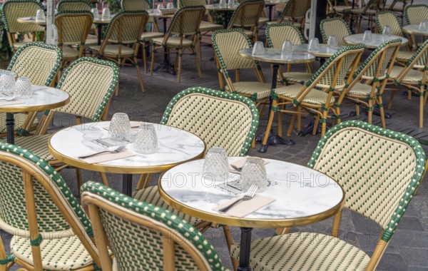 Outdoor scenery with tables and chairs seen in Normandy, France
