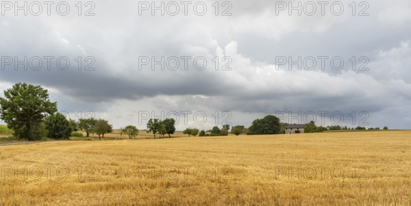 Stormy farmland scenery in Hohenlohe, an area in Southern Germany at late summer time