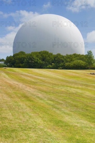 Gigantic white cupola with parabolic antenna inside, seen in Brittany, France