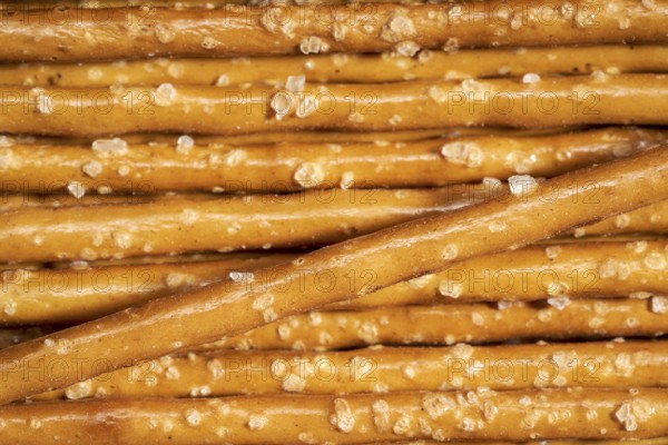 Closeup of some salt sticks in light back