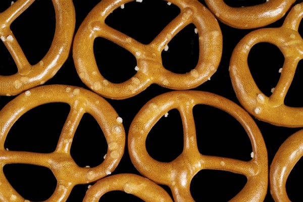 Closeup of some lye pretzels in dark back