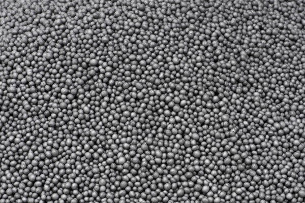 Full frame closeup showing lots of dark polystyrene beadlets