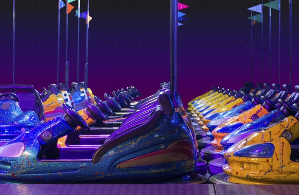 Rowed colorful bumper cars in front of gradient colored back