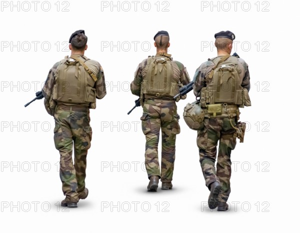 Rear view of a three person military patrol isolated in white back with shadow