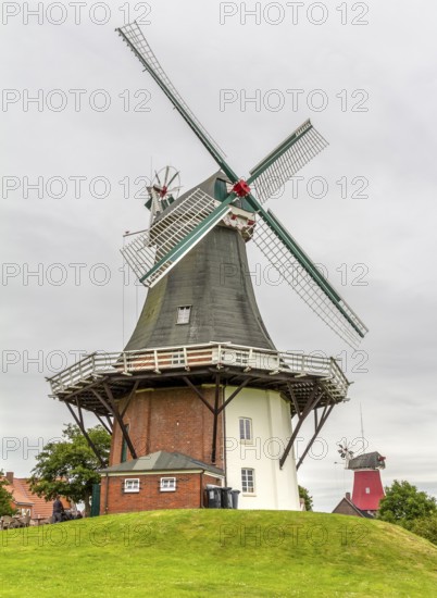 The twin windmills in Greetsiel, a idyllic village located in East Frisia, Northern Germany